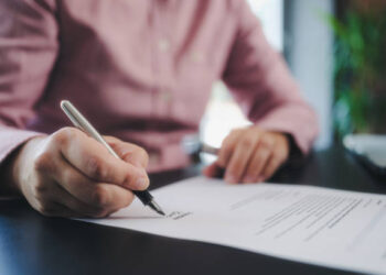 What Will Writing Offers Beyond Basic Legal Forms? 5 businesswoman signing an official document